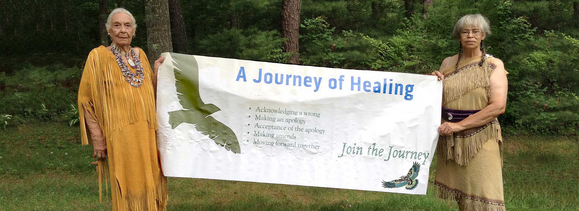 Clan Mothers holding Journey of Healing banner